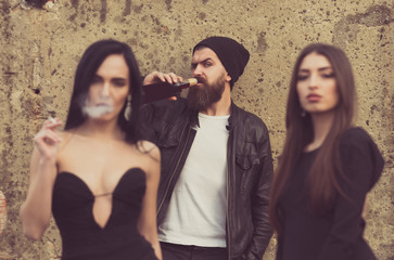 woman smoking cigarette with friends
