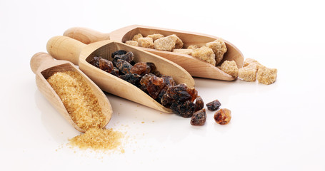 Composition with brown sugar on white background