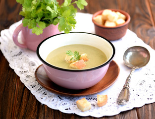 Soup puree from zucchini with cream and crackers.