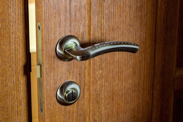 door with the handle and the lock.