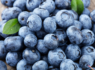 Heap of blueberries with leaves