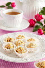 Homemade dietary sweets with dried fruits in white chocolate.