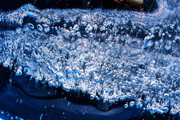 Frozen gas bubbles settle on the air cavity in the ice. A beautiful natural phenomenon. Greenhouse...