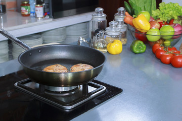  cooking fish in luxury kitchen