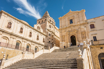 Facade and stairs of the Church of Saint Francis Immaculate in the Noto, Sicily, Italy. - obrazy, fototapety, plakaty