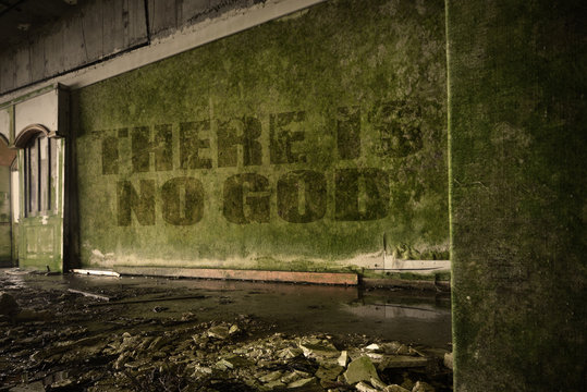 text there is no god on the dirty wall in an abandoned ruined house