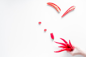 red food with chili pepper on white background top view space for text