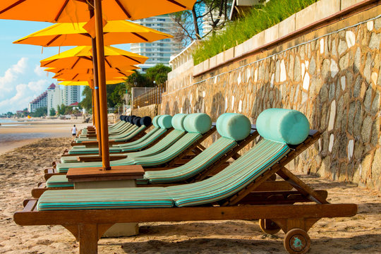 chairs and umbrella on stunning tropical beach in Hua Hin Thailand