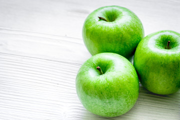 Healthy green food with apples on kitchen white background
