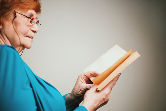 Old woman reading a book