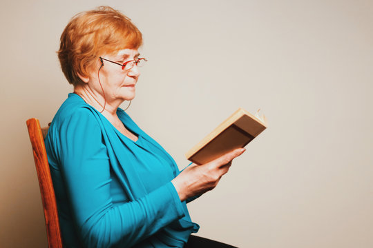 Old woman reading a book
