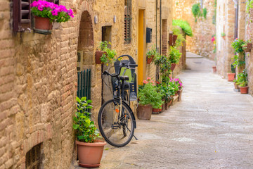 Fototapeta na wymiar View of an alley in the historic district of Colle Val d'Elsa a small town near Siena in Tuscany