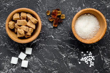 lumps and sanding sugar for sweets on kitchen table background top view