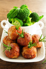 Hot meatballs with boiled potatoes and cranberry sauce ..