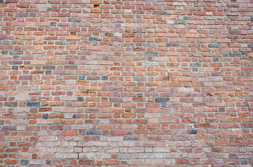 Red bricks wall background. Wall of old building useful as backdrop.