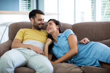 Smiling couple relaxing in the living room