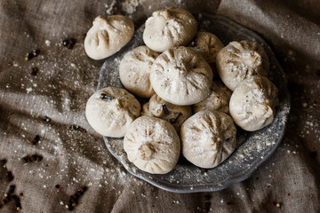 Georgian dumplings Khinkali with meat flate blacke background.