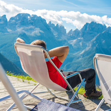Young man relaxing in mountain resort.