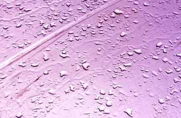 Water drops on metal surface with blur effect.