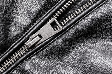 Half zipped metal zipper in black coat jacket. © Paweł Michałowski