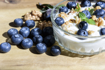 Curd dessert with nuts and fresh blueberries