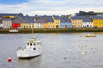 Irish coastal landscape with the typical colored fishermen's houses with sloping roofs (Galway - Ireland) - obrazy, fototapety, plakaty