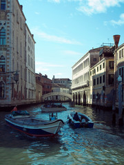 Canal in venice with bridge and boats