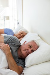 Senior couple sleeping in the bedroom