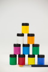 Pyramid of watercolor paints and paint brushes