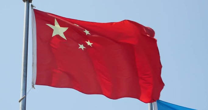 4k Chinese flag flutters in wind.