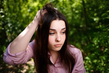 Fototapeta premium Portrait of attractive young hesitant perplexed woman face close up