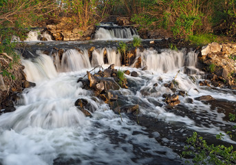 Waterfall at the sunset in forest big