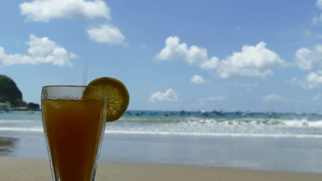 Tropical drink with Pacific Ocean on background