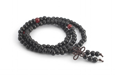 A sandalwood rosary on a white background. Isolated