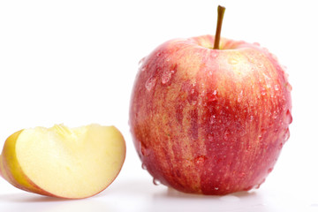 red apple with water drops isolated on white