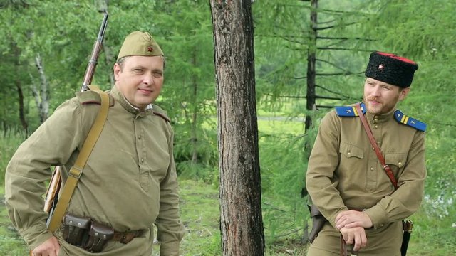 The army of the USSR. Soviet army soldiers are resting. Soldiers listen to a gramophone. Soviet Union soldiers in camp. Reconstruction of the Soviet army.