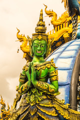 Sculpture of green angel at Rong Sua Ten temple