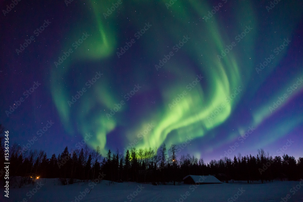 Wall mural dancing lights over frozen lake