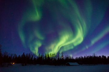 Dancing lights over frozen lake