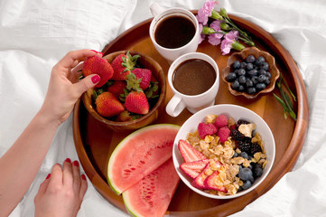 Healthy breakfast and coffee in the bed.