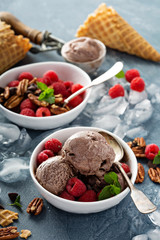 Chocolate ice cream with fresh berries in bowls