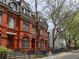 Fototapeta na wymiar shady street with large Victorian style houses