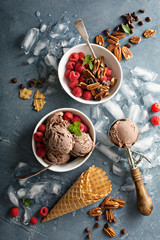 Chocolate ice cream with fresh berries in bowls
