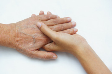 Fototapeta premium young hand hold older hand