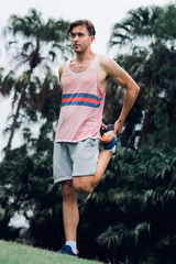 Sport man stretching in the park