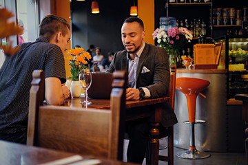 Men having a business meeting in a restaurant.