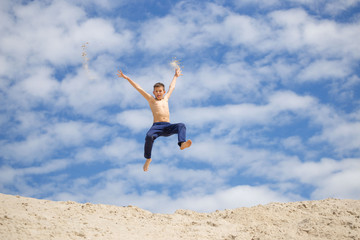 GOMEL, BELARUS - May 13, 2017: Teens study parkour on their own. Acrobatics in the sand.