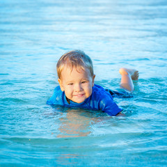 Fototapeta na wymiar Boy in a sea