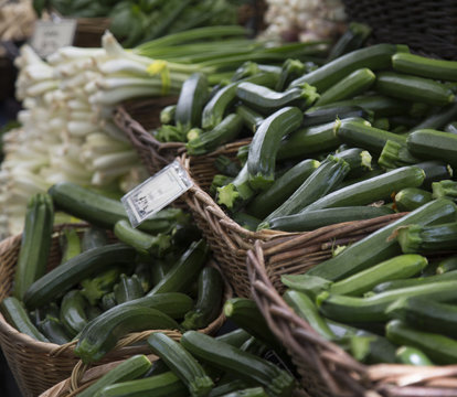 Isolated Close View of Fresh Organic Zucchini/Green Onions in Baskets, Local Farmers Market, Background Backdrop Use with Text Copy Space Overlay (HDR Image) -  - Eugene, Oregon, USA