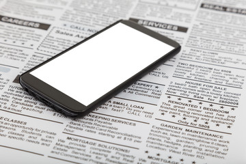 fake newspaper and smartphone